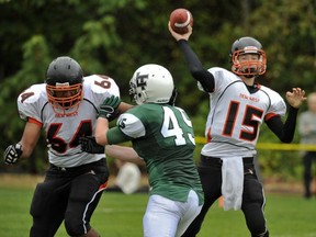 New Westminster quarterback Tommy Robertson looks downfield Friday against the Lord Tweedsmuir Panthers in Cloverdale. (Les Bazso, PNG)