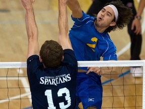 UBC Thunderbirds' Ben Chow powers home one of his 10 kills Friday at War Gym as No. 10-ranked UBC upset No. 1-ranked Trinity Western on the opening night of the 2012-13 Canada West volleyball season. (Richard Lam, UBC athletics)