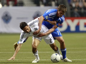 The Vancouver Whitecaps and Montreal Impact are deadlocked in the standings heading into the final regular-season game. The top Canadian finisher will have a favourable Amway Canadian Championship draw in 2013. (Jeff Vinnick/Getty Images)