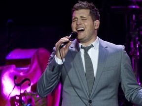 A nervous Michael Buble chose to coach rather than play Wednesday, but the super crooner donated $100,000 to three Canuck charities that benefited from the Bieksa's Buddies charity game against the UBC Thunderbirds. (Getty Images).