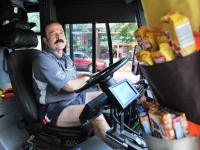 John Abou-Samra, a transit driver seen here in 2008, has held trivia contests on his bus and given out chocolates to winners to make the rides more enjoyable. (SAM LEUNG/PNG FILES)
