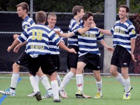 South Delta Sun Devils' Bryce Connors is congratulated by teammates after heading home the winning goal in a 1-0 victory over host North Delta Huskies at Delsom Park turf on Thursday.