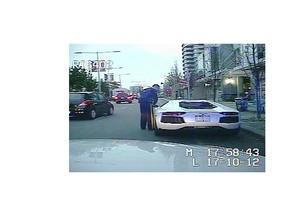 Police camera shows $430,000 2012 Lamborghini Aventador that was pulled over for not having a front licence plate but was found not to have insurance because the driver said he couldn't afford it. He also complained about the $568 fine, claiming it was too high. (RCMP FILES)
