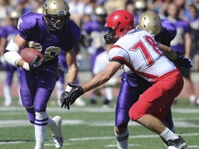 Trucking along, Vancouver College running back Liam Mahara relishes the physical contact that comes with carrying the football. (Jason Payne, PNG)