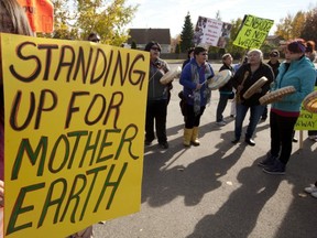 Anti-pipeline demonstrators protest outside the Joint Review Panel looking into the Northern Gateway Pipeline in Prince George on Tuesday. (THE CANADIAN PRESS)