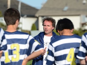 South Delta Sun Devils senior boys soccer coach Stephen Burns addresses his team at halftime of 3-2 win against the host Delta Pacers on Tuesday.