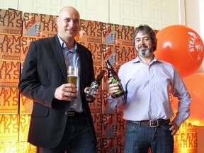 Steamworks president Walter Cosman (left) and owner Eli Gershkovitch at the brewery's bottle launch.