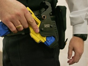 The use of tasers, such as this one being demonstrated in Britain, has fallen 87 per cent in B.C. since 2007, a legislative committee was told this week. (AFP/GETYY IMAGES FILES)