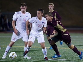 The Clan men's soccer team has thrived on its blend of veterans and youth this season, including its central midfield pairing of senior Michael Winter (left, 16) and freshman Alex Rowley (centre, 22). SFU plays its final regular season match Sunday against Western Washington. (Ron Hole, SFU athletics).