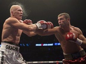 Lucian Bute, left, from Montreal, lands a right to the head of Denis Grachev, from Russia, during their North American Boxing Federaton light heavyweight  title fight Saturday, November 3, 2012 in Montreal. Bute won on a unanimous decision.THE CANADIAN PRESS/Ryan Remiorz