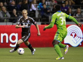 Kenny Miller in action against Seattle Sounders. The Scottish forward is training with Rangers this off-season. Many fans wonder if he'll return to Vancouver at all after a tough transition to MLS. (Jeff Vinnick/Getty Images)