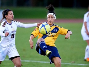 Trinity Western's Jessica King is eyes by Laurier's Suzanne Boroumand during CIS national quarterfinal clash Thursday in Victoria. (Scott Stewart, TWU athletics)