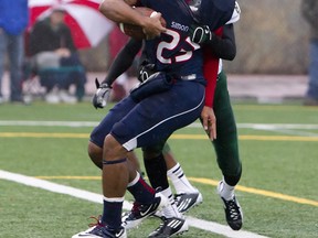Simon Fraser's Lemar Durant scores the first of his two second-half TDs Saturday under the cover of cloud and rain as the Clan upset Humboldt State on Fox Field. (Ron Hole, SFU athletics)