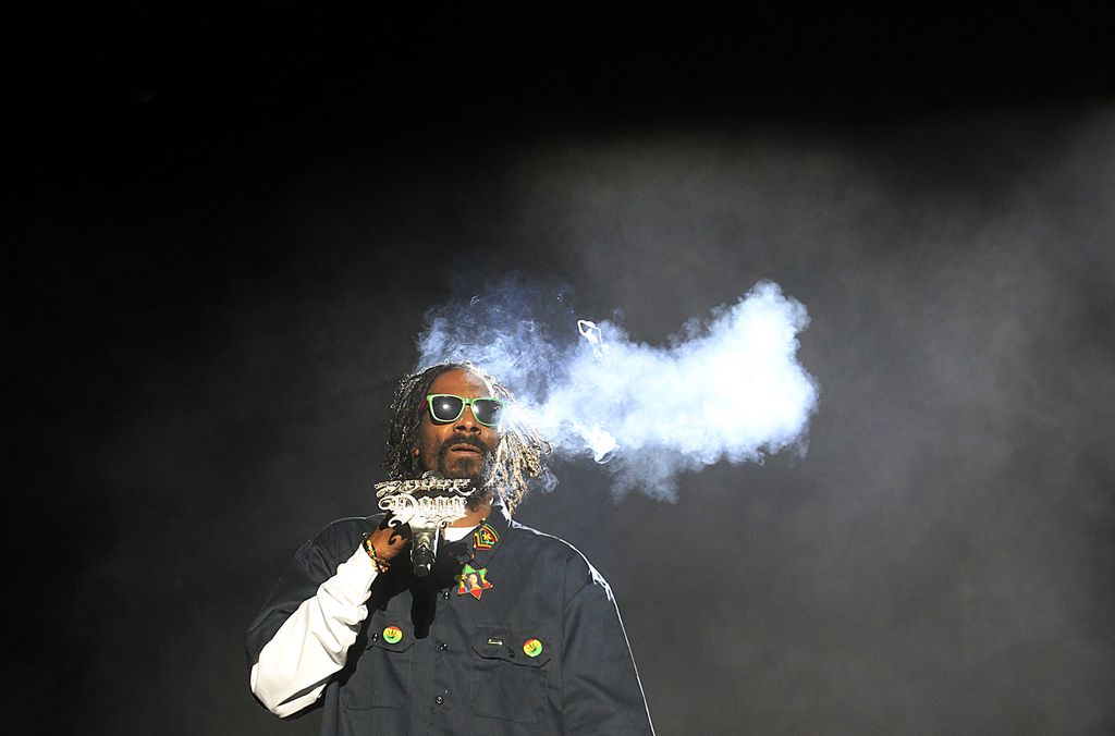 Snoop Dogg smokes onstage at the Coachella Valley Music and Arts Festival, April 13, 2012 in Indio, California. (LUIS SINCO / LA TIMES , MCT)