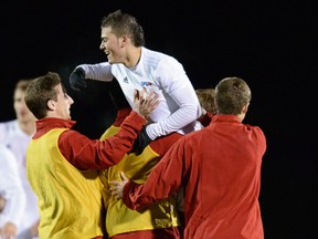 SFU's Lucas Ferritto is hoisted high after potting the game-winning goal in the Clan's 2-1 NCAA opneing-round tournament win over Cal State-Stanislaus on Saturday in Hayward, Cal. (Photo -- Michael Chen)