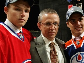 Igor Larionov, with clients Alex Galchenyuk (left) and Nail Yakupov at the 2012 NHL draft, believes former teammate Pavel Bure should have his jersey retired by the Vancouver Canucks (Getty Images via National Hockey League).