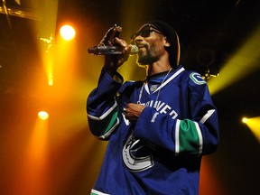 Rapper Snoop Dogg dons a Vancouver Canucks jersey at his 2012 summer appearance at the Commodore Ballroom.