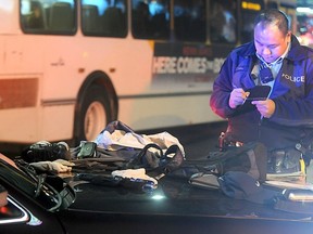 Richmond RCMP officer collects evidence after armed robbery at Richmond Centre. One gun-packing suspect was taken down by bystanders. (RICHMOND NEWS FILES)