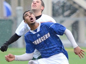 Cariboo Hill (blue) and Sands opened the BC senior boys 2A soccer tournament to relentless rain Monday at Burnaby Lakes (contributed photo)