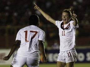 Jenna Richardson (R) of Canada celebrates with teammate Nkem Ezurike (L) after scoring against Panama during a Concacaf women’s under 20 semifinal soccer  match at the Rommel Fernandez stadium on March 9, 2012, in Panama City. (STR/AFP/Getty Images)