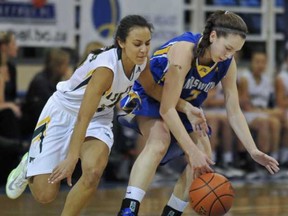 Argyle's Claire Elliott (left) hounds Handsworth's Abby Dixon during Telus Basketball Classic final at UBC. (Les Bazso, PNG)