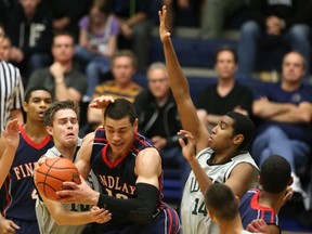 Walnut Grove Gators Brad Hoffman (left) and David Wolde-Mariam try to slow Findlay Prep forward Gavin Schilling during TBI clash Saturday at the Langley Events Centre. (langleyeventscentre.com photo)