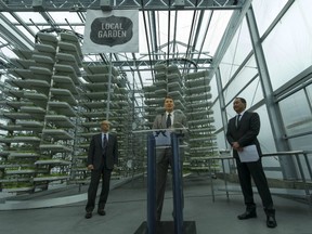 Rick Sielski of Vancity and Christopher Ng of Alterrus flank Vancouver Mayor Gregor Robertson at opening of controversial greenhouse in city parkade. (Ward Perrin/PNG FILES)