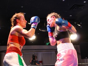 Canadian champion Sarah Pucel (right) moments from landing a hard left hand against Lucia Larcinese in their championship bout December 7. Photo: Jacqueline Langen.