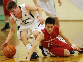 Kelowna's John Katerberg (left) keeps a step ahead of St. George's Mitchell Tang during Telus Basketball Classic quarterfinals Thursday at Sir Charles Tupper in Vancouver. (Gerry Kahrmann, PNG)