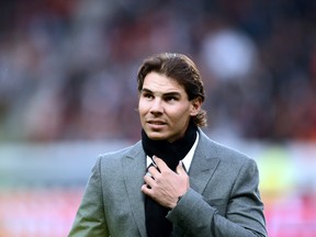 Spain's tennis player Rafael Nadal is pictured before the French L1 football match between Paris Saint Germain and Reims on Oct. 20, 2012 at the Parc des Princes stadium in Paris.  FRANCK FIFE/AFP/Getty Images