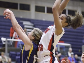 SFU Clan forward Nayo Raincock-Ekunwe grabs one of her record 24 rebounds in Saturday's 87-55 win over visiting Trinity Western. (Ron Hole, SFU athletics)