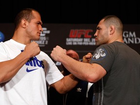 Champion Junior dos Santos (left) and challenger Cain Velasquez throw down tonight in the main event of UFC 155. (photo courtesy of Zuffa LLC)