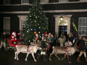 Santa -- perhaps the myterious "Joe" -- appears with sleigh and reindeer during a Christmas party hosted for sick children at 10 Downing Street on Dec. 17, 2012, in London, England. (GETTY IMAGES)