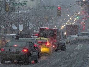 Buses and other traffic were stopped on Granville Street during last week’s snow storm because the road wasn’t clear, but bike lanes were a high priority for snow removal, something really irritated many readers. (Ward Perrin/PNG FILES)