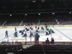 Injured Vancouver Canucks winger David Booth missed his third day of training camp on Tuesday.