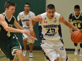 Tamanawis' Grade 11 standout Sukh Bains (right) drives down court against Kenton Sanderson of St. Patrick's during Kushnir Memorial semifinal Friday night in Ladner.