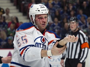 Edmonton Oilers' Ben Eager shows off his makeup after a fight with Zack Kassian Jan. 20, 2013 in Vancouver.