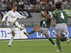 The Whitecaps signed midfielder Daigo Kobayashi on Monday. The Japanese League veteran is shown here in 2005, playing for Tokyo Verdy against Real Madrid and David Beckham. (Getty Images)