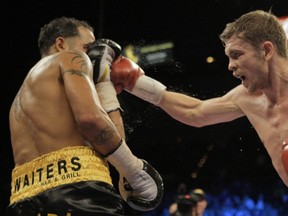 Foreman digs a right hand against Daniel Santos in his title winning performance in 2009. Photo courtesy Jae C. Hong/AP