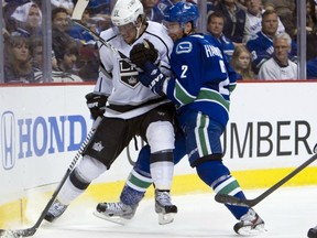 Dan Hamhuis, left, wrestles with Kings centre Anze Kopitar during 2012 Stanley Cup playoffs.