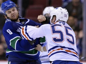 Zack Kassian (9) and Ben Eager in Sunday night's game. (Photo by Rich Lam/Getty Images)