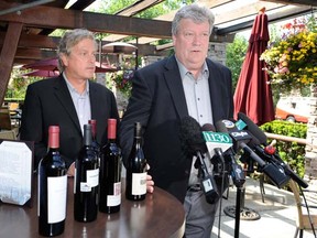 Provincial energy and mines minister Rich Coleman (right) announces changes to the Bring Your Own Bottle laws -- for wine only -- on July 19, 2012, alongside B.C. Restaurant and Foodservices president Ian Tostenson.