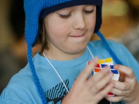 Carter Ladouceur practises before a Rubik’s Cube competition at Burnaby’s Crystal Mall in March 2011. His parents drove him all the way from Edmonton to compete in his first competition.
 (Ward Perrin/PNG FILES)