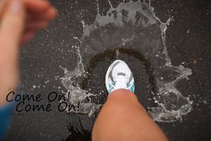 Runner in Puddle