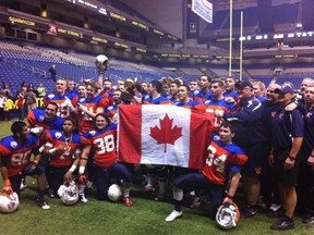 Team BC shows its national pride as it celebrates Saturday in Texas. (Photo -- Pat Waslen, Football BC)