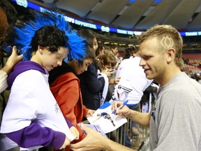 According to a Harris/Decima study, Whitecaps' fans have a strong connection to their team compared to the rest of the country. Captain Jay DeMerit takes a moment with a fan last season. (Getty Images)
