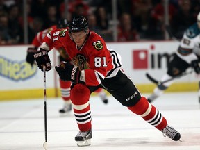 Marian Hossa got the worst of a clash with Jannik Hansen, and now the NHL wants to speak with Hansen about it. (Charles Rex/AP)