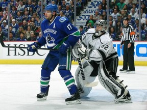Canucks centre Ryan Kesler screens Kings' goaltender Jonathan Quick during last spring Stanley Cup playoffs. (Jeff Vinnick/Getty Images)