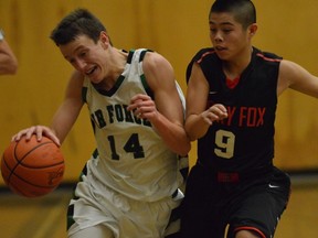 Sebastian Marshall (left) of the Pitt Meadows Marauders, is hounded by Terry Fox Ravens' Jomari Reyes during Fraser Valley North league finale Friday at Pitt Meadows. (PNG photo)