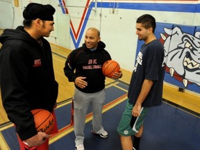 SWC Bulldogs Mindy Minhas (left) and Jesse Mushiana flank head coach Rick Lopez at the Marpole-area school. (PNG photo)